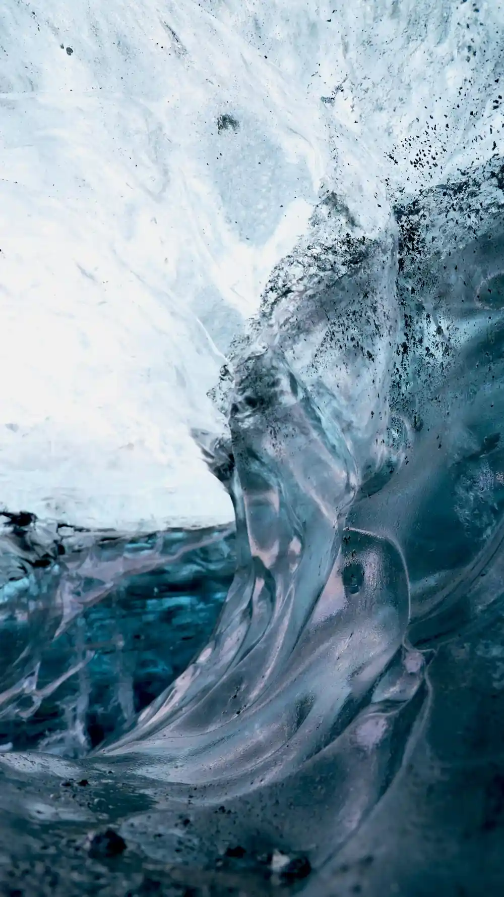 Close-up of blue-white ice cave swirling patterns