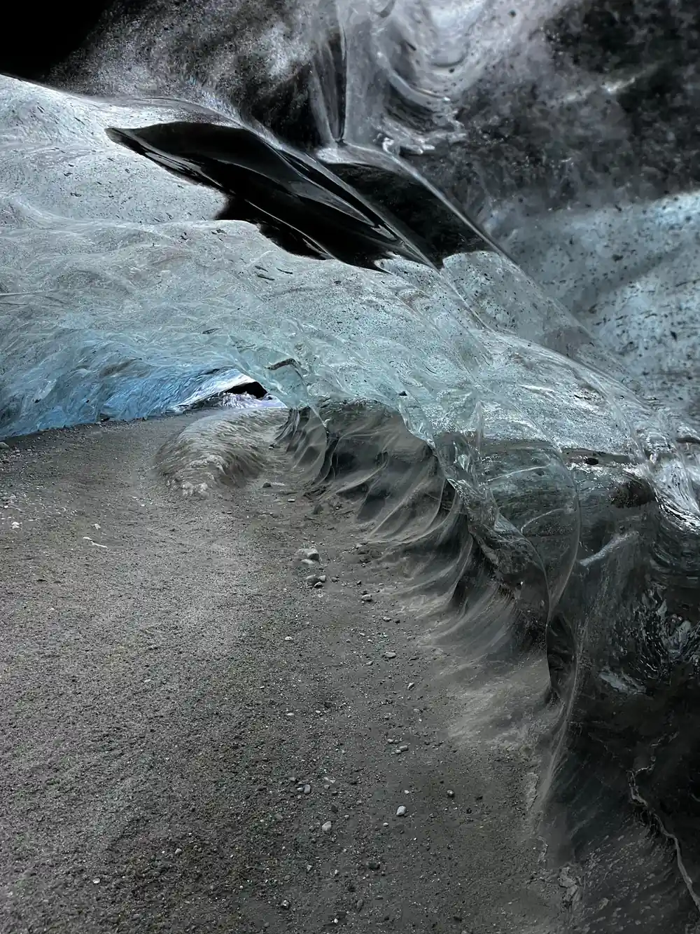 Dramatic ice formations with crevasses and dark cracks