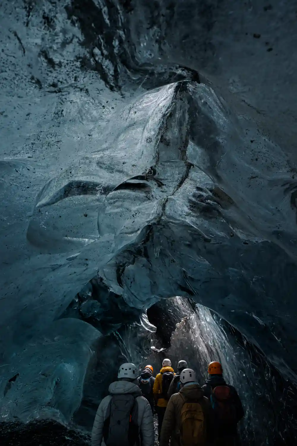 Layered glacial ice formation with dark sediment streaks