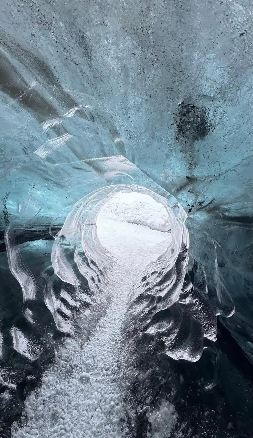 Sculptural ice formations inside glacier cave